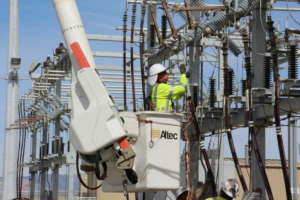 Man in bucket working on substation