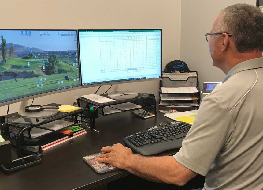 Employee sitting at computer desk